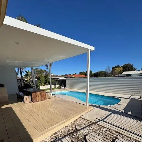 Exposed aggregate pool surround by CoastCrete