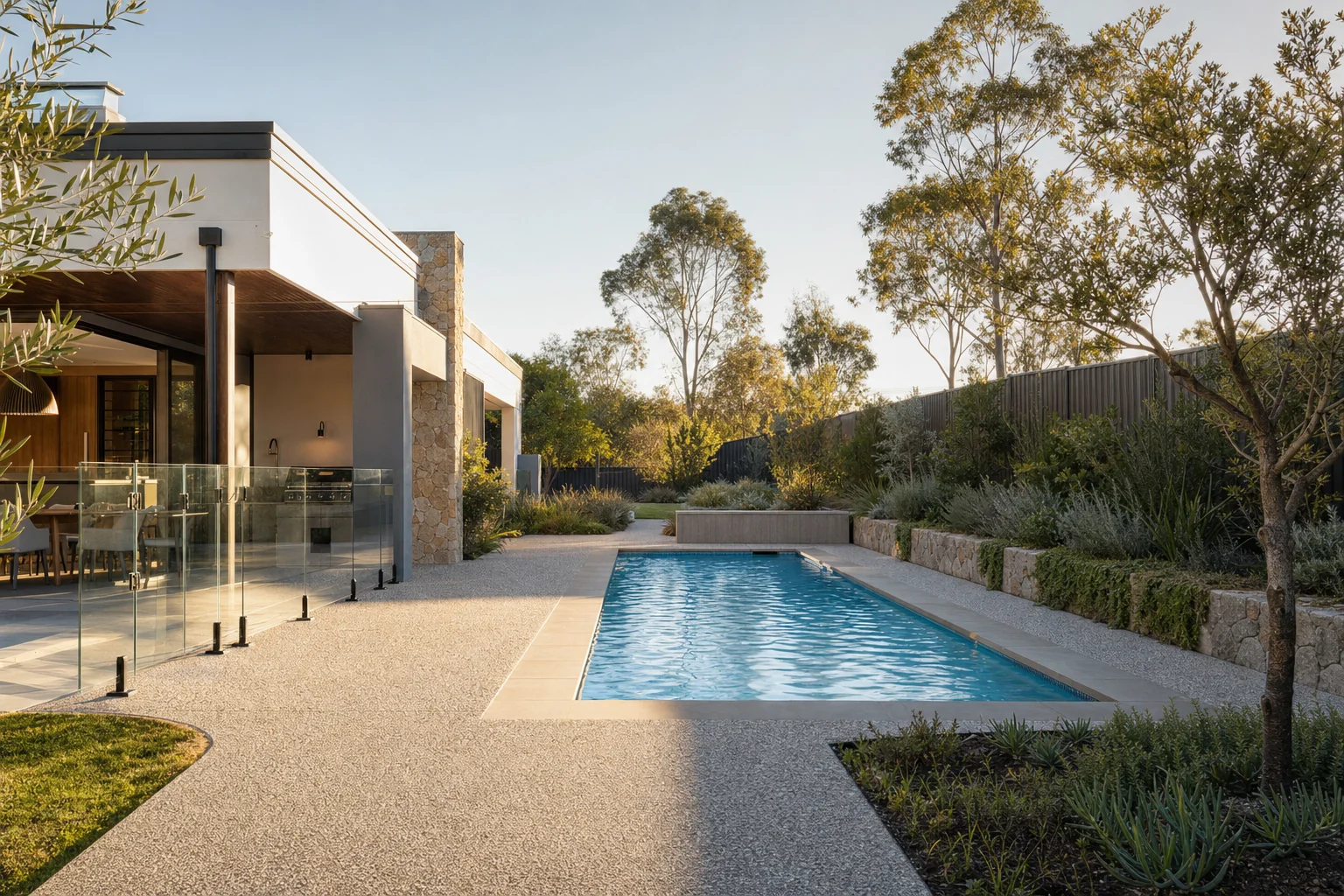 Exposed aggregate concrete pool surround and path at a Perth home