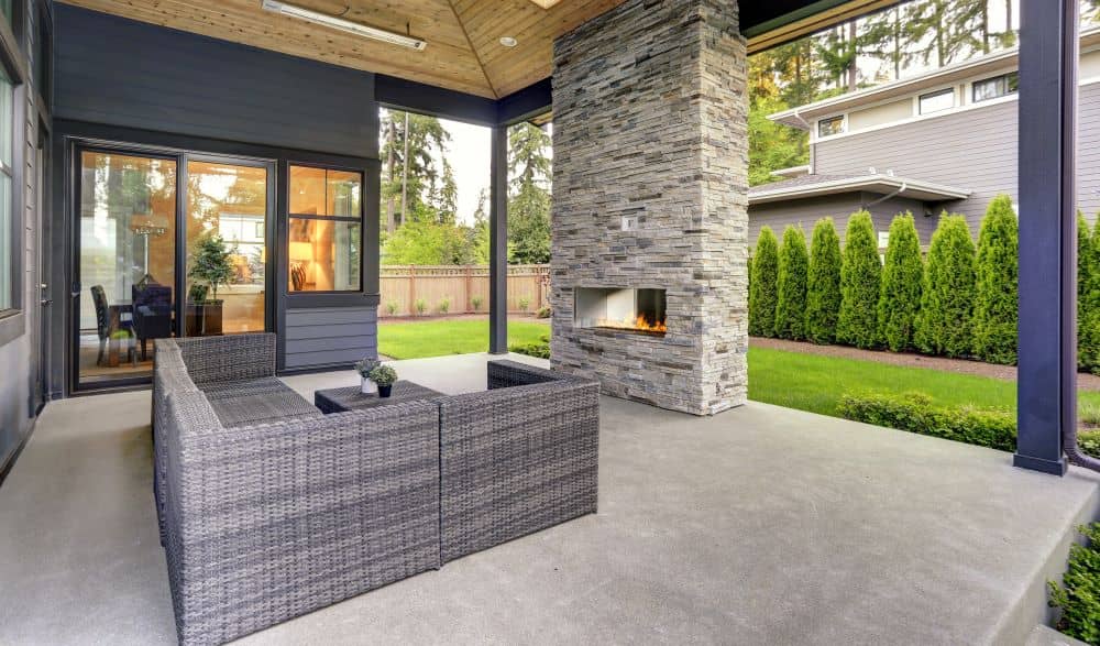 Modern home patio with fireplace.