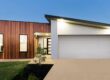 Modern home with liquid limestone driveway.