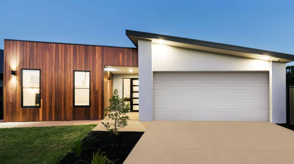 Modern home with liquid limestone driveway.