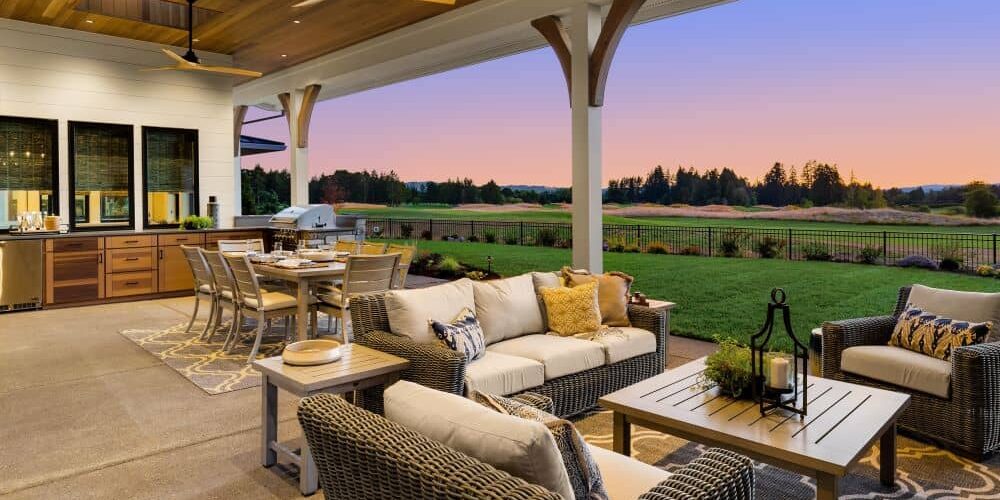 Covered patio with kitchen, dining area, and living area.