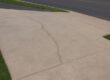 cracked exposed aggregate concrete driveway