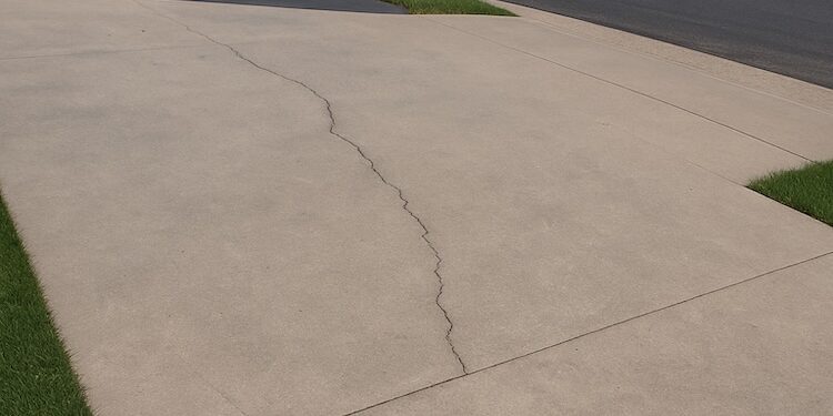 cracked exposed aggregate concrete driveway